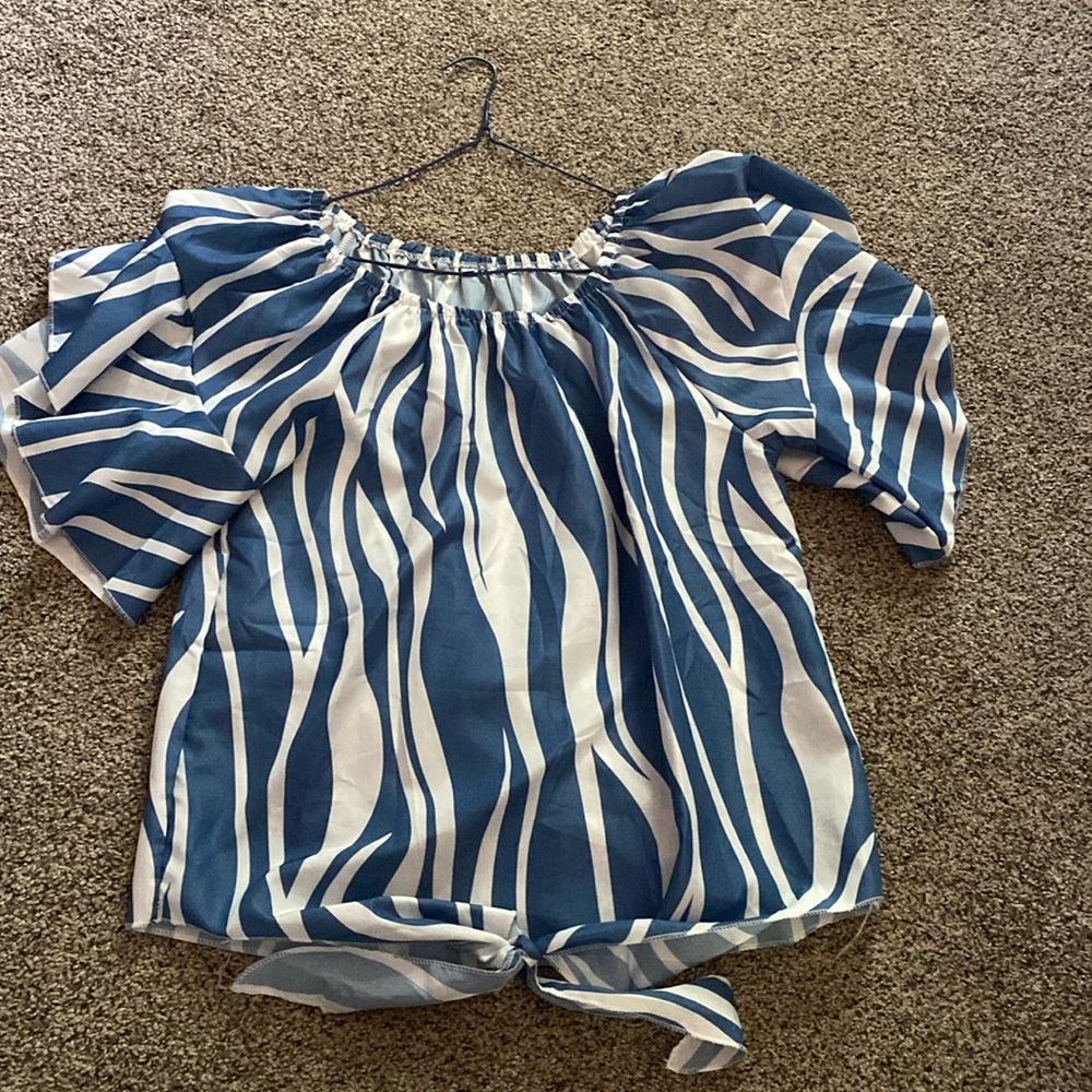 Blue and white shirt.